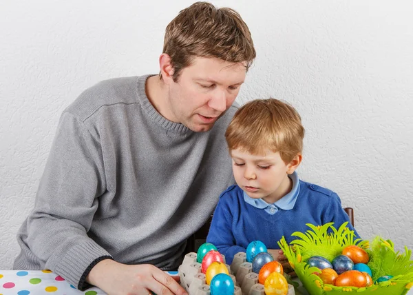 Little boy and his mother being happy about selfmade Easter eggs — Stock Photo, Image