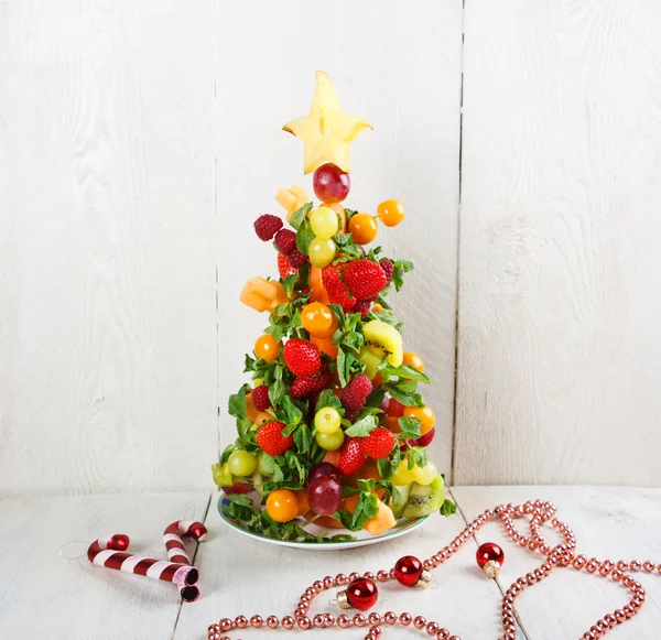 Fruit Christmas tree with different berries, fruits and mint — Stock Photo, Image