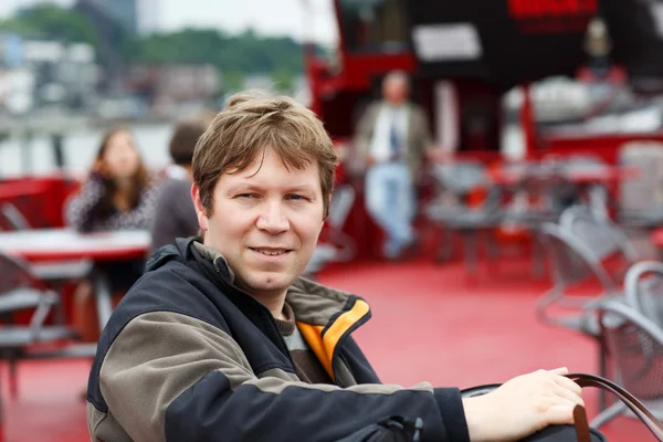 Beautyful young man on a ferry. — Stock Photo, Image