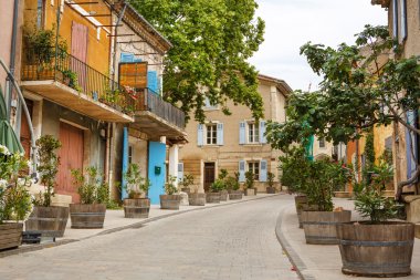 Provencal street with typical houses in southern France, Provenc clipart