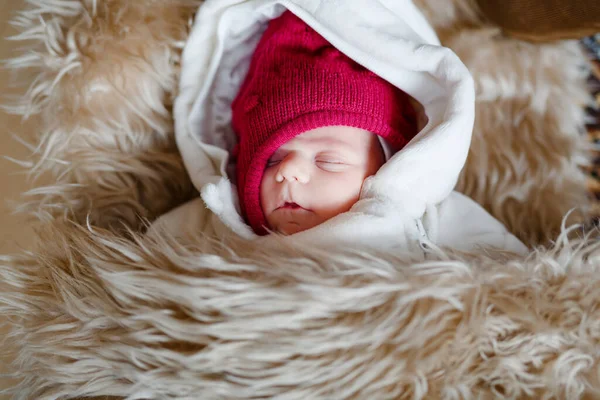 Portrait of sleeping newborn baby in warm winter clothes. Beautiful cute girl in warm overall, cap. Peaceful child sleep during outdoor walk — Stock Photo, Image