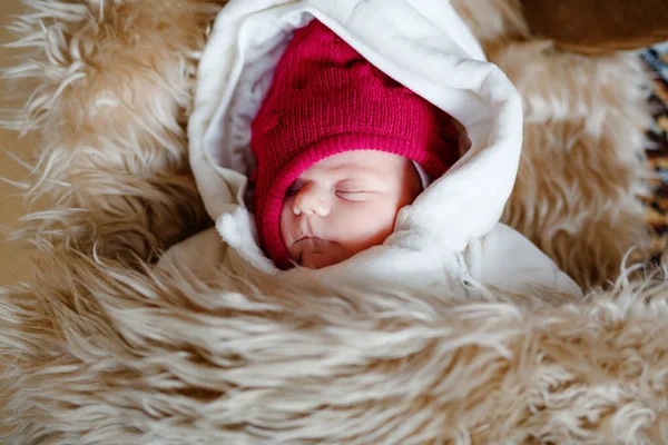 Portrait of sleeping newborn baby in warm winter clothes. Beautiful cute girl in warm overall, cap. Peaceful child sleep during outdoor walk — Stock Photo, Image