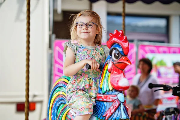 Adorable Little Preschool Girl Glasses Riding Animal Roundabout Carousel Amusement — Stock Photo, Image