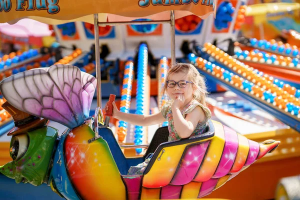 Adorable Little Preschool Girl Glasses Riding Animal Roundabout Carousel Amusement — Stock Photo, Image