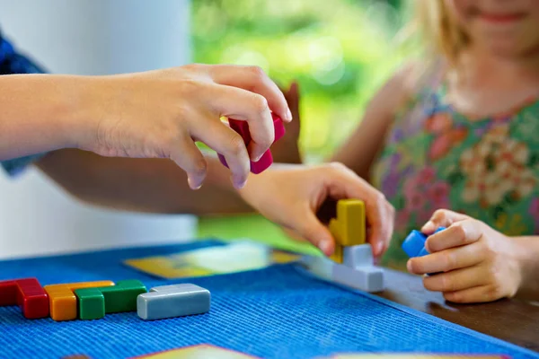 Children Playing Board Game Colorful Bricks Closeup Hands Build Tower — Fotografia de Stock