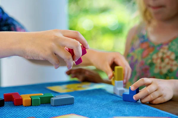 Children Playing Board Game Colorful Bricks Closeup Hands Build Tower — Stock Fotó