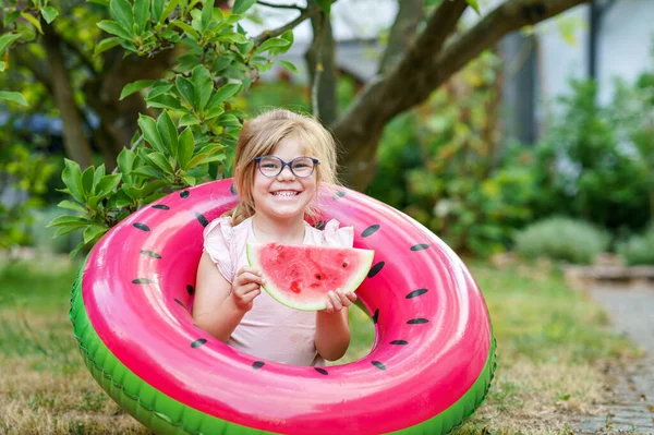 Cute Little Girl Glasses Eating Watermelon Inflatable Ring Summertime Happy — Zdjęcie stockowe