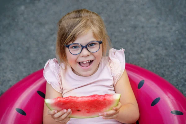 Cute Little Girl Glasses Eating Watermelon Inflatable Ring Summertime Happy — Zdjęcie stockowe