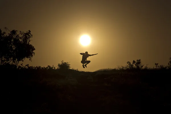 Jump at sunset — Stock Photo, Image