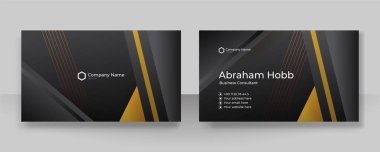 Modern creative and clean business card template. Luxury business card design template. Elegant dark black background with abstract golden shiny wavy lines. Vector illustration