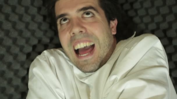 Crazy guy in a straight jacket — Stock Video