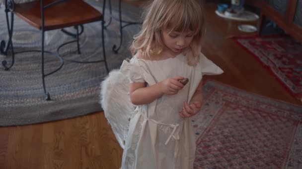 Angel toddler inside — Stockvideo