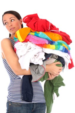 Young Woman Carrying a Pile of Washing