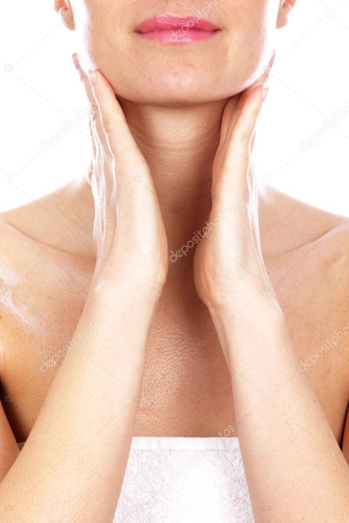 Young Woman Applying Body Cream