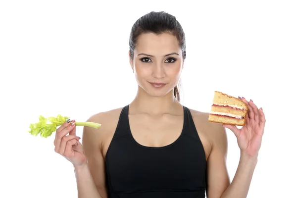 Mulher Comparando Alimentos Saudáveis e Insalubres — Fotografia de Stock