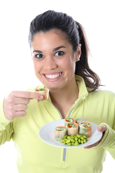 Attraktive junge Frau beim Essen — Stockfoto