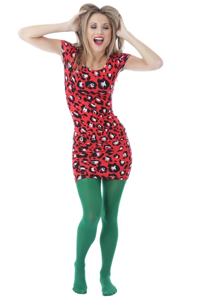 Sexig ung kvinna som bär en kort mini klänning och gröna strumpbyxor — Stockfoto