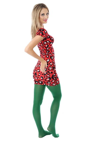 Jeune femme portant une mini robe rouge et collants verts — Photo