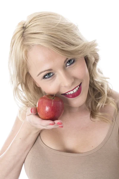 Młoda kobieta trzymająca czerwone jabłko — Zdjęcie stockowe
