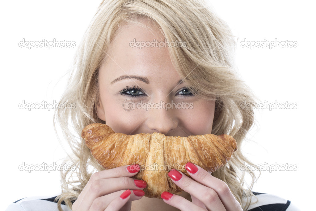 Young Woman Eating a Breakfast Croissant
