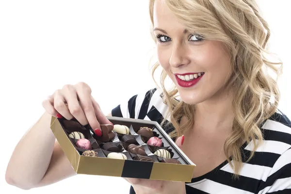 Attractive Young Woman Eating Chocolates — Stock Photo, Image