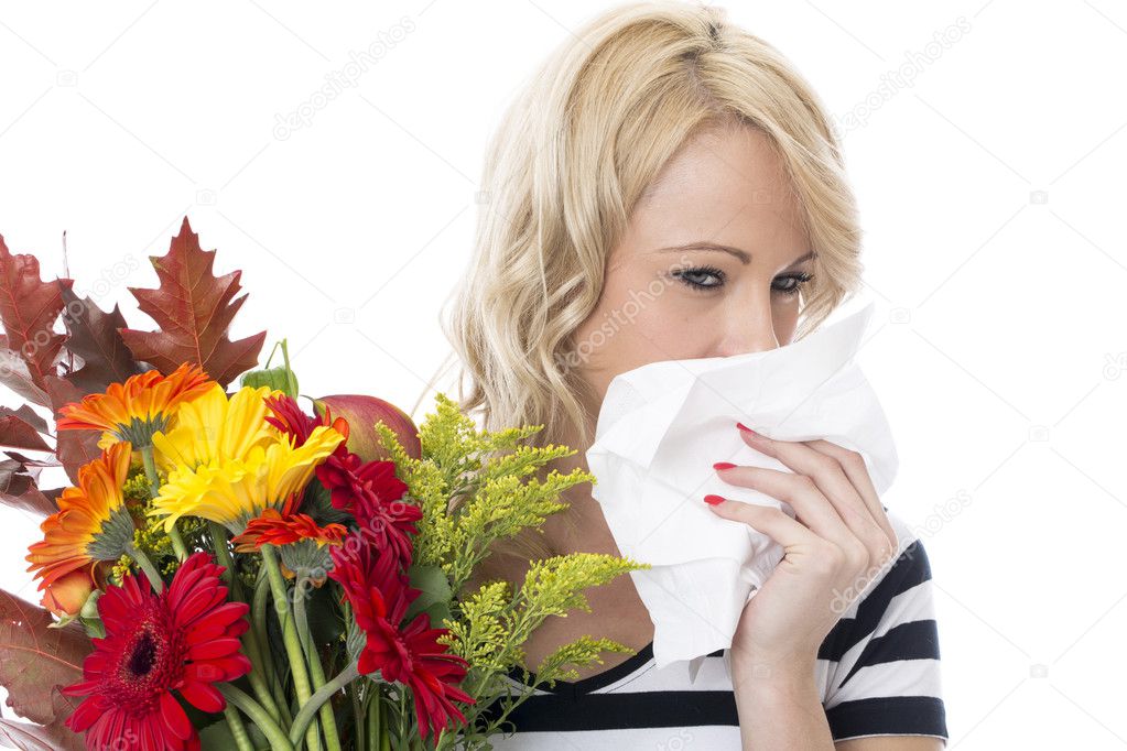 Attractive Young Woman with Hayfever Holding a Bunch of Flowers