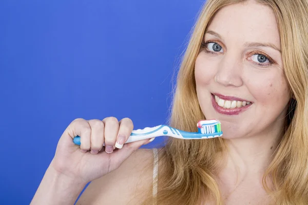 Happy Young Woman Brushing Teeth — Stock Photo, Image