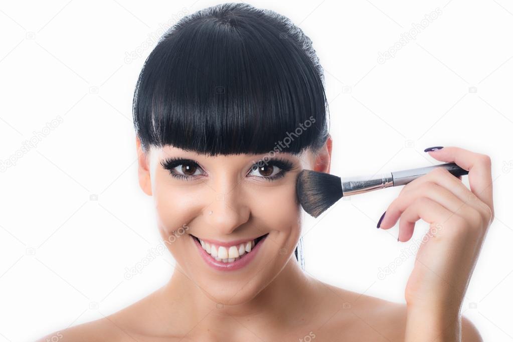 Young Woman Applying Face Powder