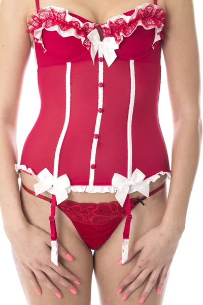 Sexy jovem mulher posando no vermelho lingerie — Fotografia de Stock