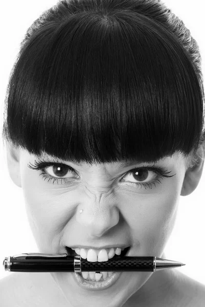 Young Woman Holding a Pen in her Mouth — Stock Photo, Image