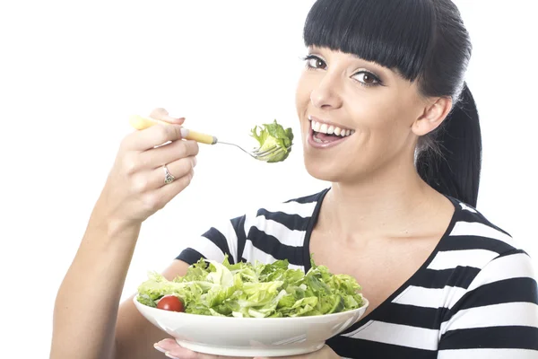 Jeune femme manger de la salade verte Images De Stock Libres De Droits