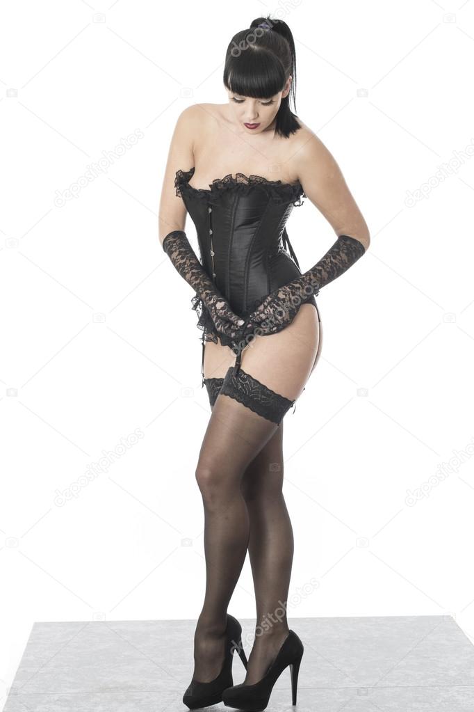 Fetish Model Posing in Stockings and Corset