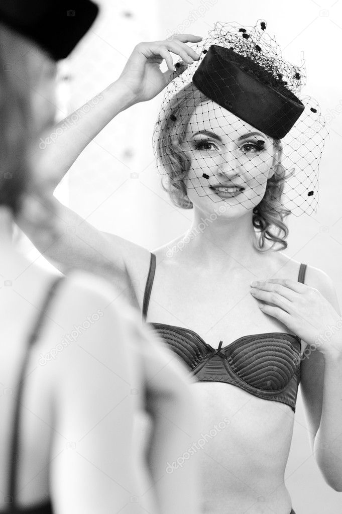 Attractive Vintage Pin Up Model Looking in Mirror