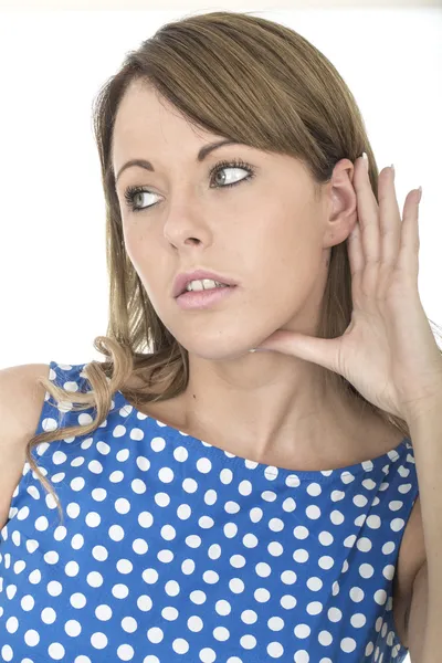 Young Woman Wearing Blue Polka Dot Dress Eavesdropping Stock Picture