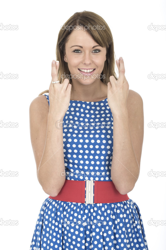 Young Woman Wearing Blue Polka Dot Dress Fingers Crossed