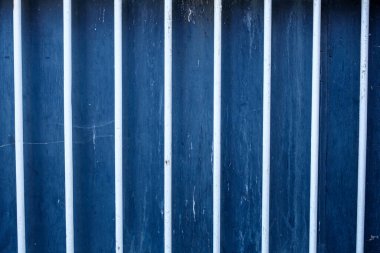 Dorking, Surrey Hills, London UK, July 07 2022, White Painted Security Bars Against A Blue Wooden Background With No People