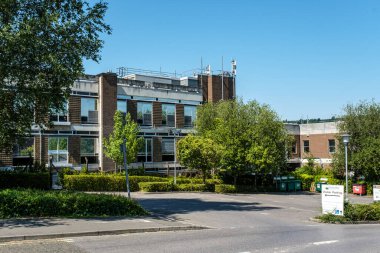 Dorking, Surrey Hills, London UK, August 13 2022, Low Rise Commercial Office Block Or Development With Blue Sky And No People