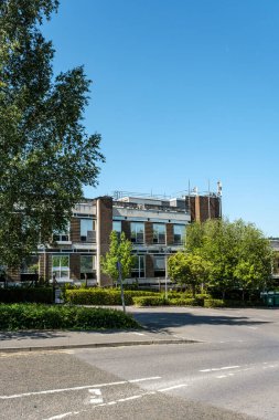 Dorking, Surrey Hills, London UK, August 13 2022, Low Rise Commercial Office Block Or Development With Blue Sky And No People