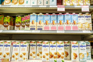 Epsom Surrey, August 14 2022, Selection Of Almond And Coconut Milk Cartons On Supermarket Shelf