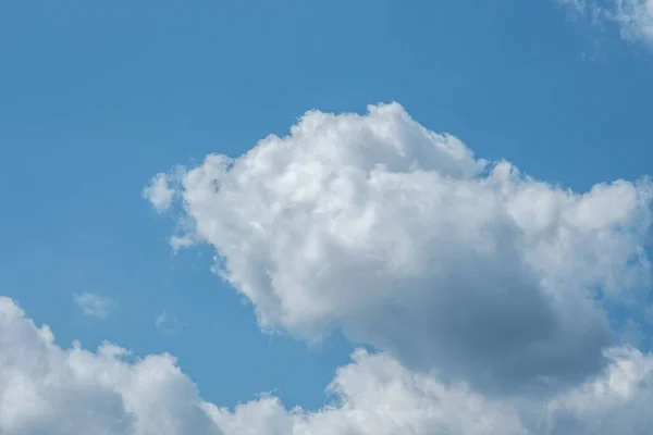 Dorking, Surrey Hills, London, UK, August 26 2022, Large White Cumulus Clouds Against A Blue Sky