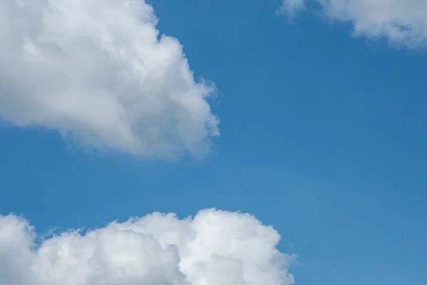 Dorking, Surrey Hills, London, UK, August 26 2022, Large White Cumulus Clouds Against A Blue Sky