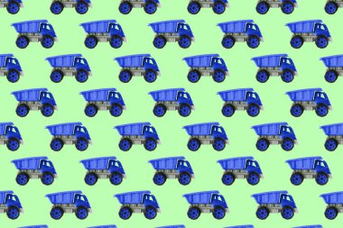 Renkli mavi plastik damperli kamyon, bahşiş kamyonu, yeşil arka planda izole edilmiş araba oyuncağı hala kusursuz desen, model, şablon, çocuklar için oyuncaklar, oğlanlar, kızlar, gelişim, oyun, çocukluk.