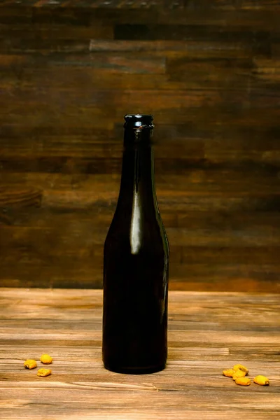 Glass Brown Bottle Beer Ale Corn Nuts Snacks Wooden Table — ストック写真