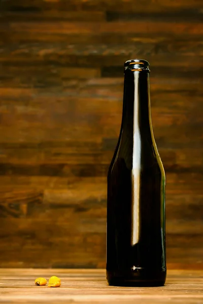 Glass Brown Bottle Beer Ale Corn Nuts Snacks Wooden Table — ストック写真