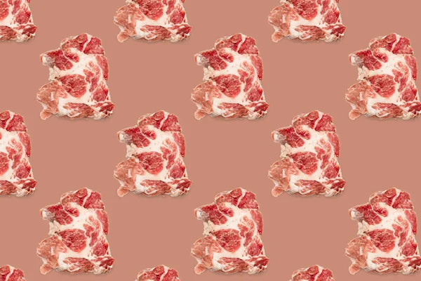Seamless food pattern with raw pork meat slices on pink red background, beef steaks. top view. Food flatly flat lay.