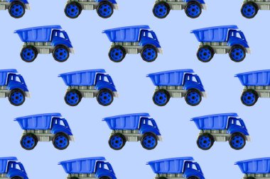 Renkli mavi plastik damperli kamyon, bahşiş kamyonu, beyaz arka planda izole edilmiş araba oyuncağı hala kusursuz desen, model, şablon, çocuklar için oyuncaklar, oğlanlar, kızlar, gelişim, oyun, çocukluk.