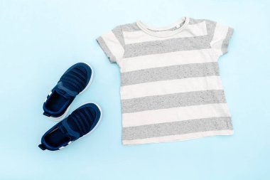 Summer babies gray clothes and accessories with t shirt,sneakers. Modern fashion kids casual outfit.Set of children's clothing for spring. Flat lay, top view,overhead,mockup.