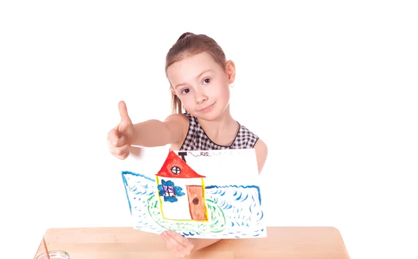 Girl shows drawn on paper house — Stock Photo, Image