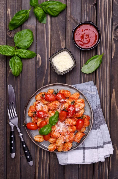 Gnocchi Tomatoes Red Sauce Cheese Basil Leaves Brown Wooden Background — Stock Photo, Image