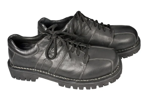 Schwarze Schuhe auf weißem Hintergrund — Stockfoto